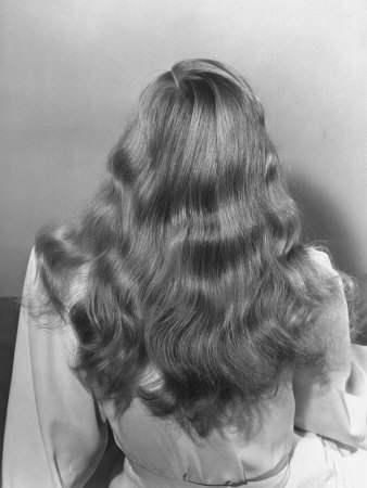 Actress Veronica Lake Posing with Her Glorious, Wavy Honey Blond Hair Cascading over Her Shoulders