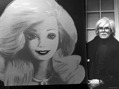 Andy Warhol Displaying His Portrait of a Barbie Doll
